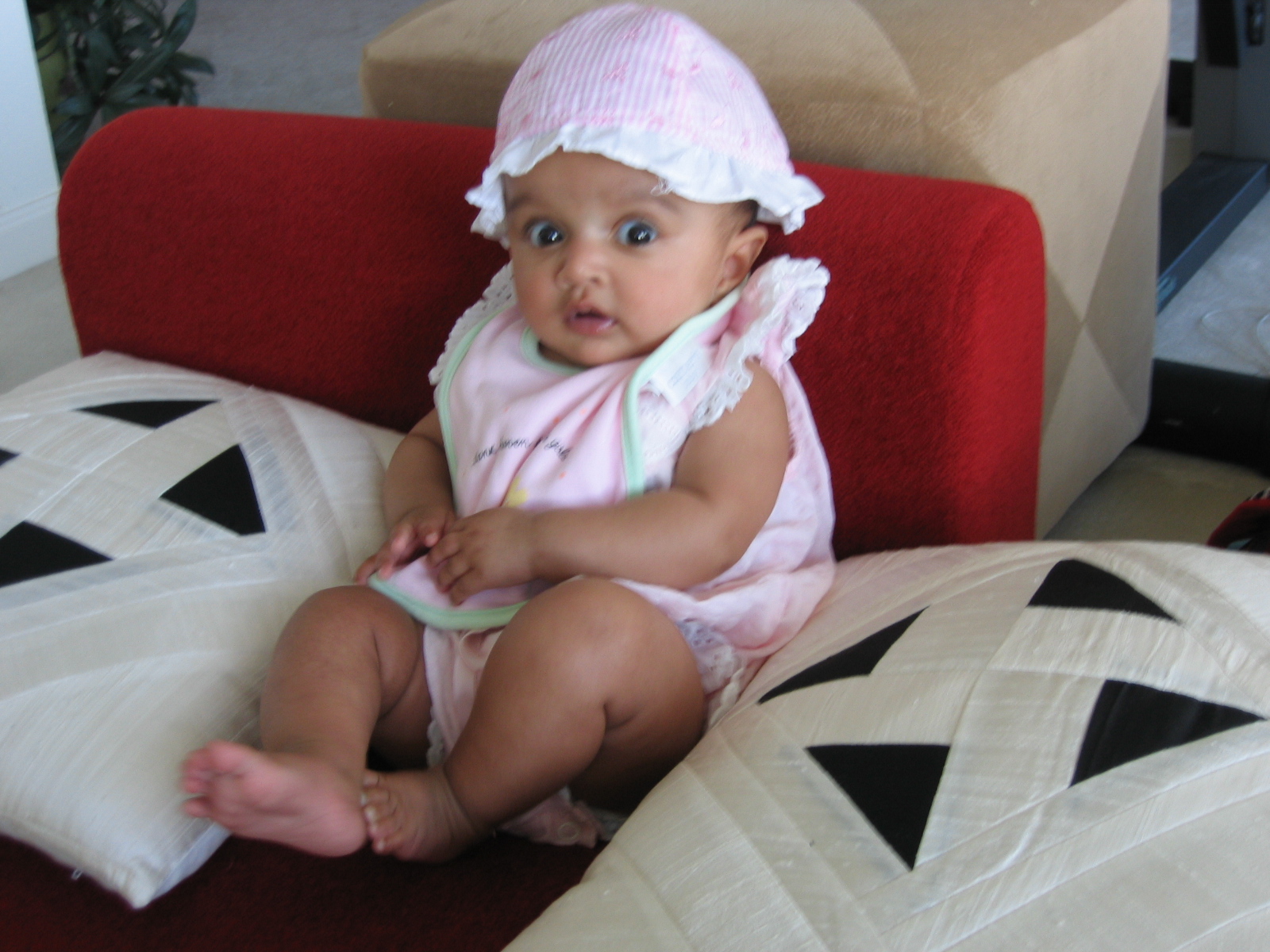 Baby in a pink sun hat